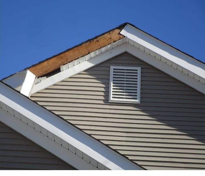 Wind blew fascia/soffit at front of house at the peak causing a gaping hole into attic. 